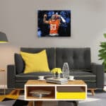 Canvas wall art painting of Tyler Boyd Big Levels Cincinnati Bengals WR celebrating in the crowd hanging above a sofa