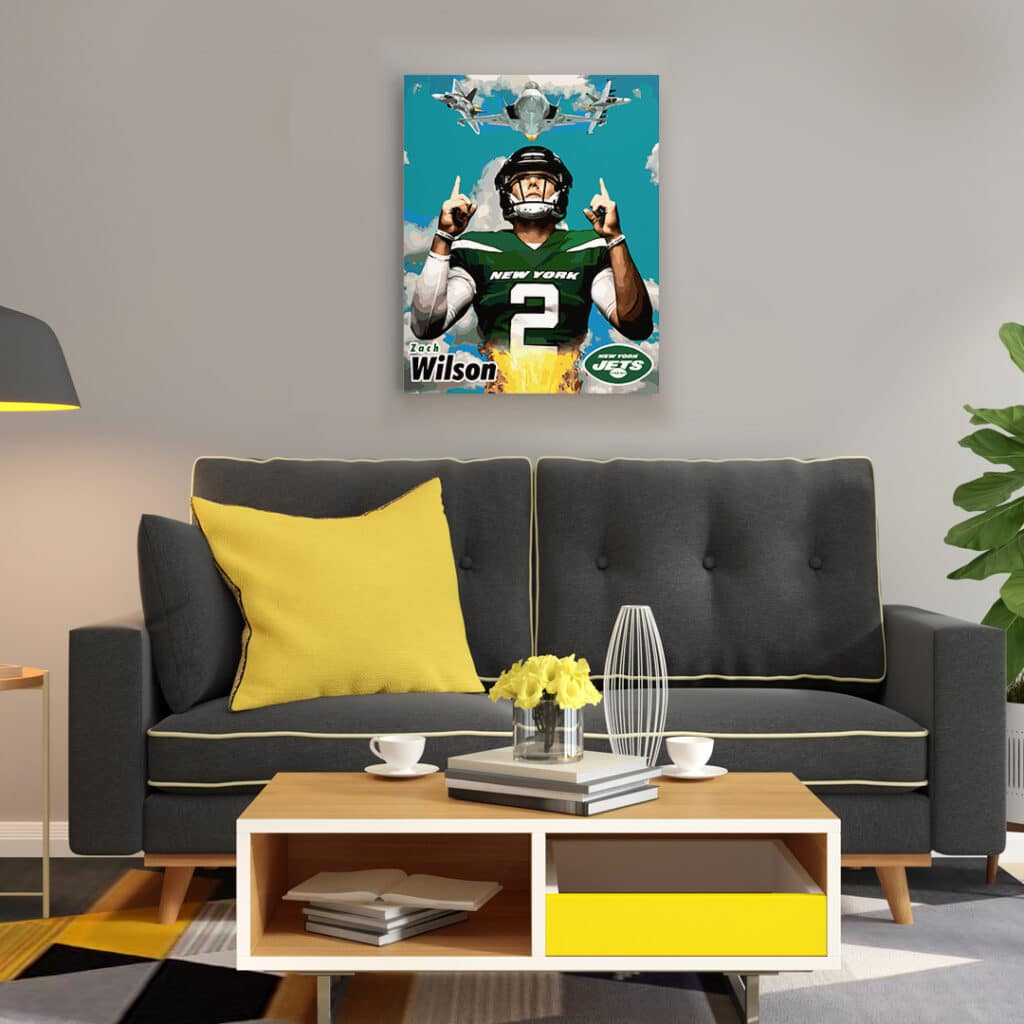 Framed canvas wall art painting of NY Jets QB Zach Wilson pointing at 3 jets in the sky hanging on wall above a sofa